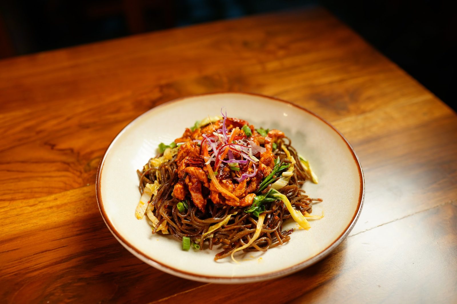Wok-tossed noodles in a bowl