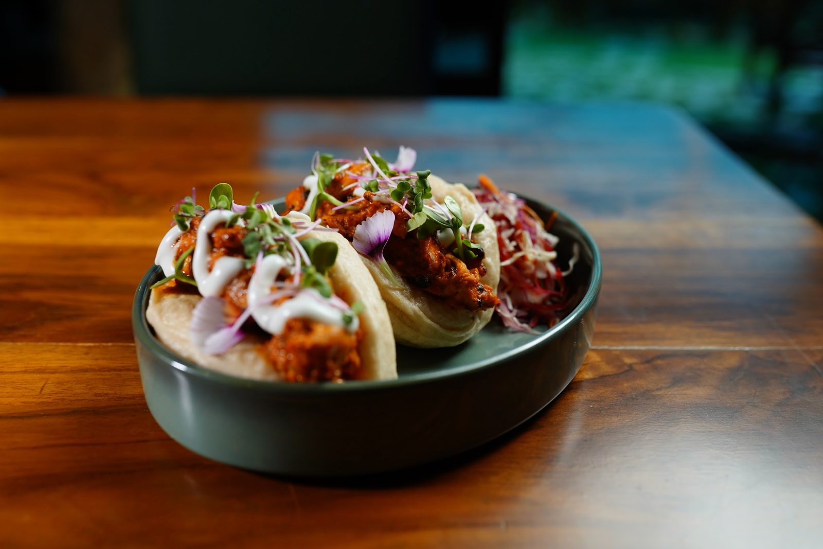 Steamed bao buns loaded with filling and sauce